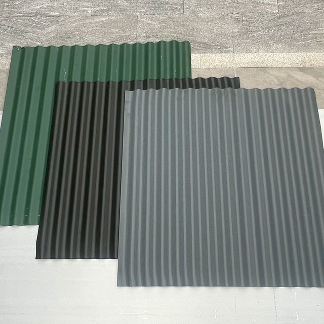 Corrugated metal sheets in green, black and grey